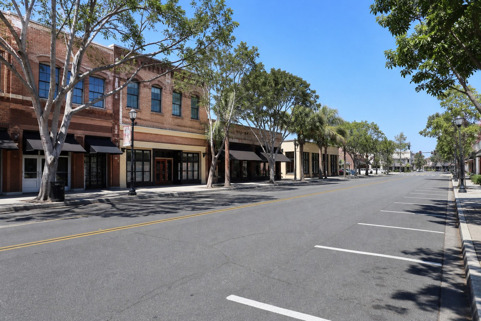 Historic Main Street storefronts and empty parking bays in Tustin
